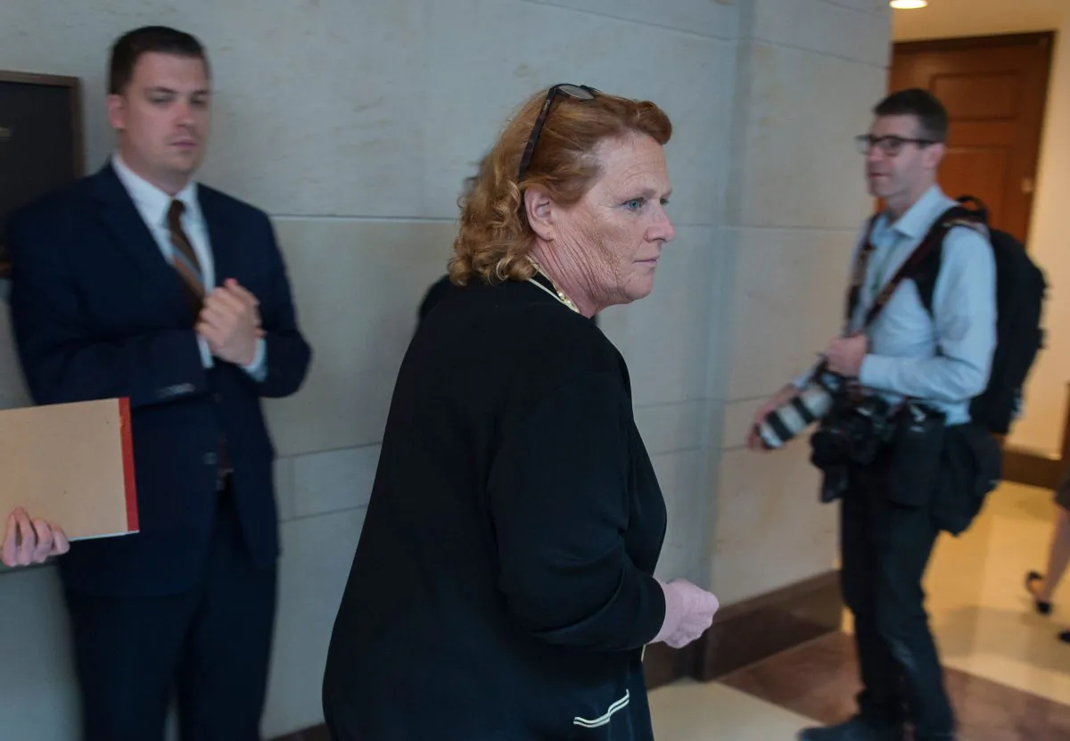 Senator Heidi Heitkamp (2nd R) on Capitol Hill on Oct. 4, 2018. (Andrew Caballero-Reynolds/AFP/Getty Images)