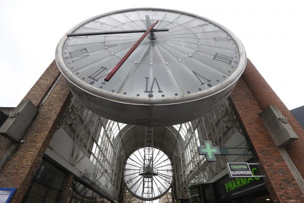 A ladder is put in place for a technician to service a huge clock in Cergy, France.