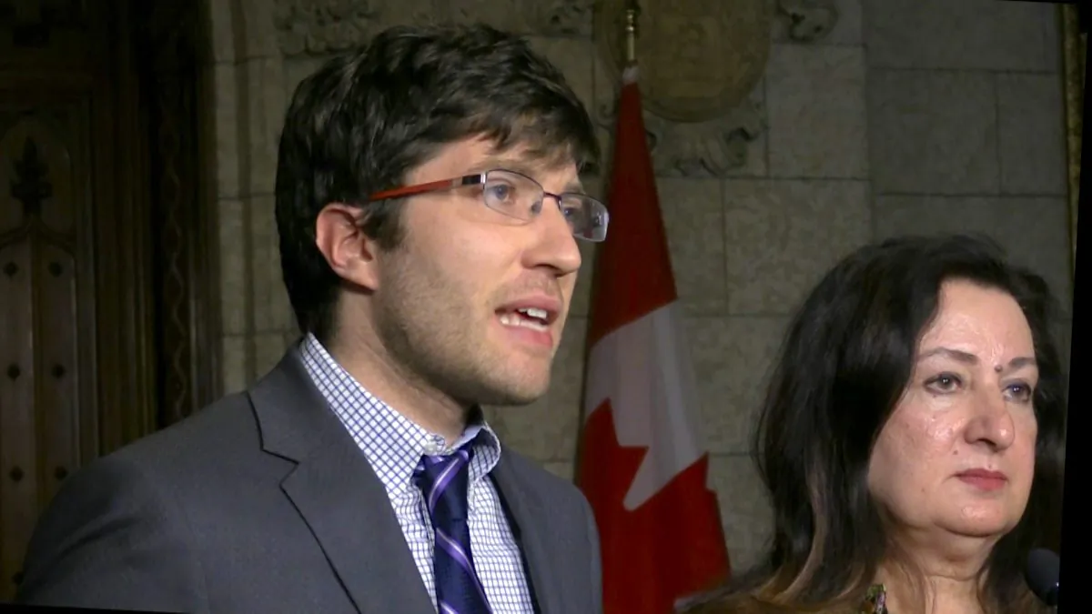 Canadian MP Garnett Genuis and Sen. Salma Ataullahjan speak at a press conference on Oct. 25 in Parliament Hill in Ottawa, two days after the passing of Bill S-240. (Limi Zhou/NTD Television)