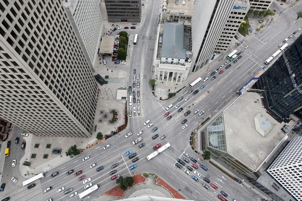 Pedestrians and traffic don't mix at Winnipeg's major and historic intersection of Portage and Main, and pedestrians cross the street by using an underground concourse. Winnipeggers considered opening the intersection to pedestrians by voting in a plebiscite included on the Oct. 24, 2018 election ballot. (The Canadian Press/John Woods)