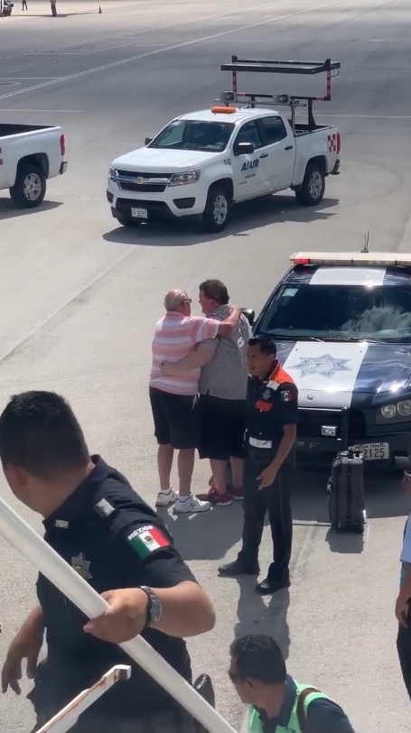 man is consoled by his father