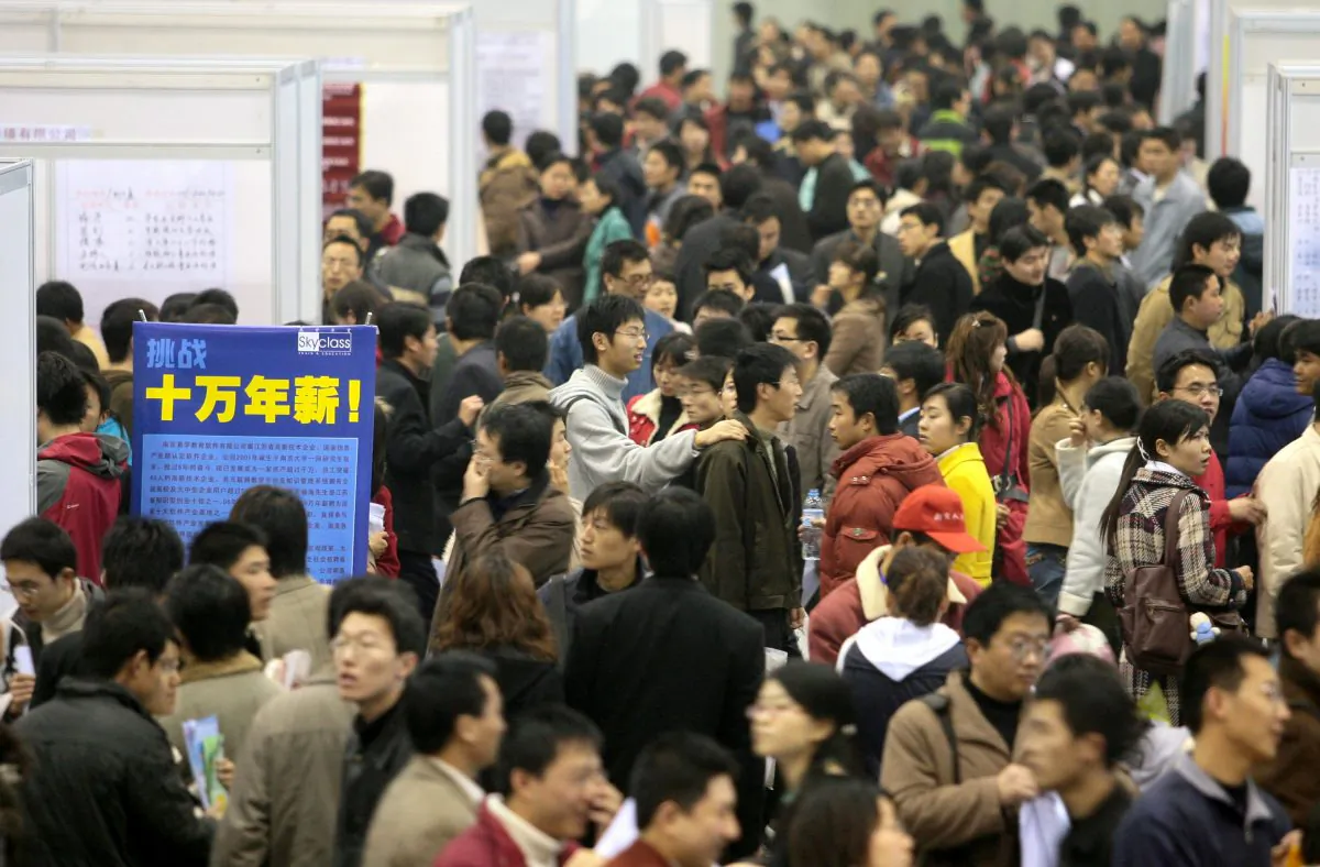 Job hunters flock to an employment fair at the International Exhibition Center March 3, 2007 in Nanjing of Jiangsu Province, China. (China Photos/Getty Images)