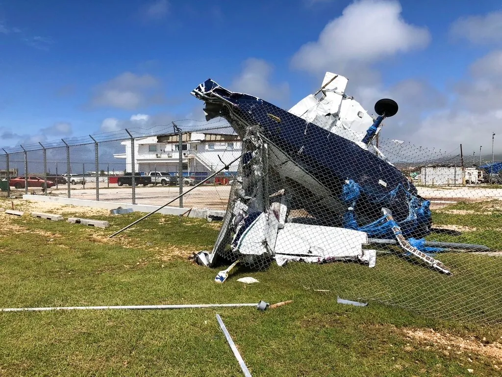 A damaged plane sits at the airport after Super Typhoon Yutu hit the U.S. Commonwealth of the Northern Mariana Islands, Oct. 26, 2018, in Garapan, Saipan. (AP Photo/Dean Sensui)