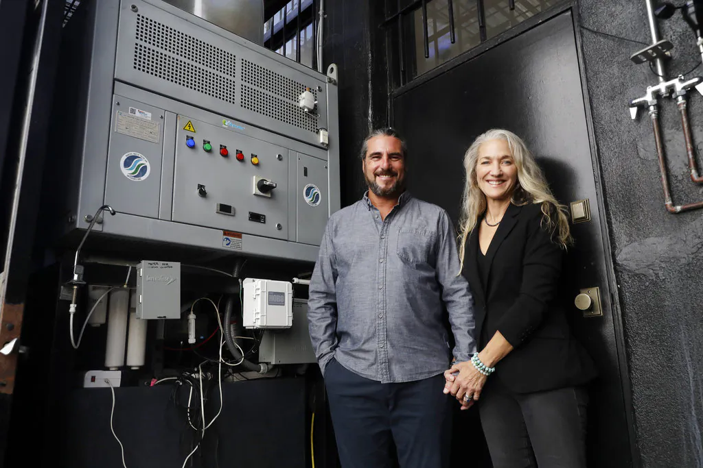 The Skysource/Skywater Alliance co-founders David Hertz, left, and his wife Laura Doss-Hertz pose for a portrait next to the Skywater 300 on Oct. 24, 2018, in Los Angeles. (AP Photo/Marcio Jose Sanchez)
