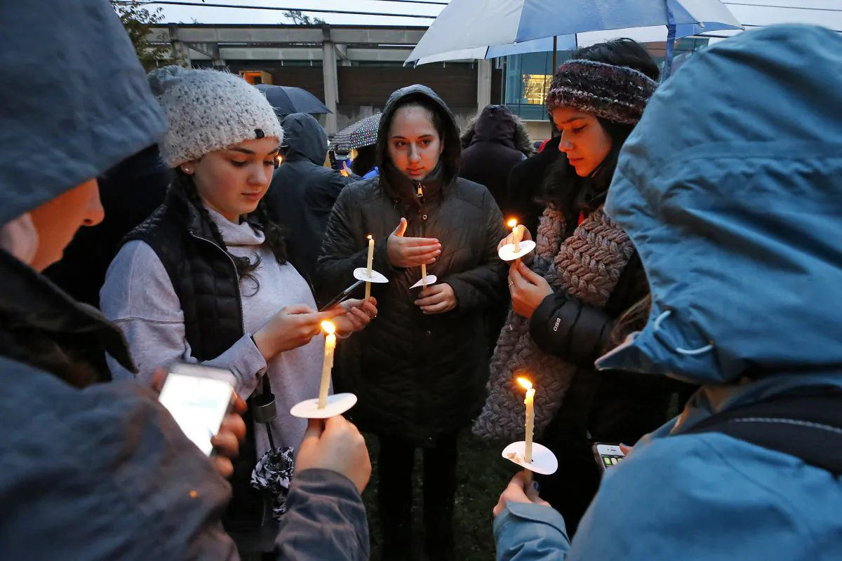 A group of girls wait for the start of a memorial, for the victims of the shooting at the Tree of Life Synagogue, on Oct. 27, 2018. (Gene J. Puskar/AP)