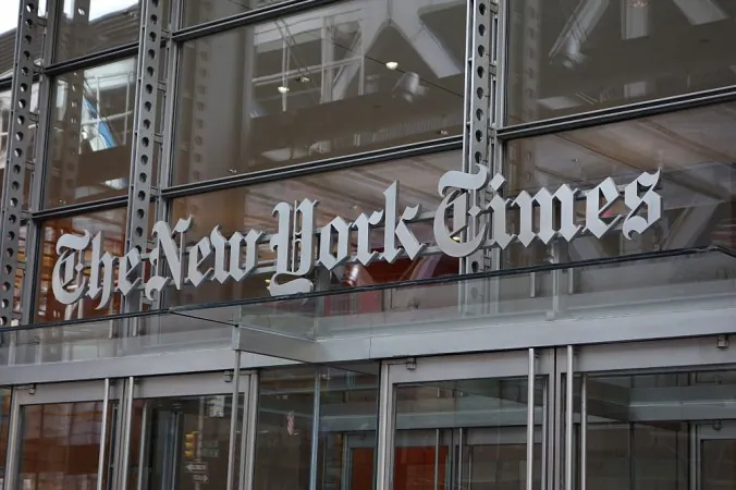 The sign over the west entrance of the New York Times building at 620 Eighth Ave. in New York on April 28, 2016. The Times has been criticized for publishing a fictional story that depicts a Russian trying to kill president Donald Trump; the story was published online on Oct. 23, 2018. (Don Emmert/AFP/Getty Images)