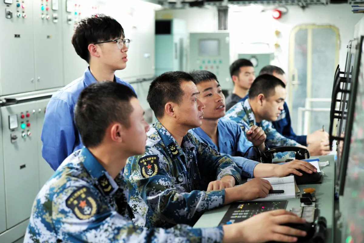 People's Liberation Army sailors working on board China's first domestically manufactured aircraft carrier, during its first sea trial at sea on May 18, 2018. (AFP/Getty Images)