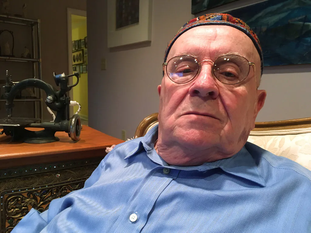 Holocaust survivor Judah Samet, 80, sits in his living room in Pittsburgh on Oct. 29, 2018. (AP Photo/Allen G. Breed)