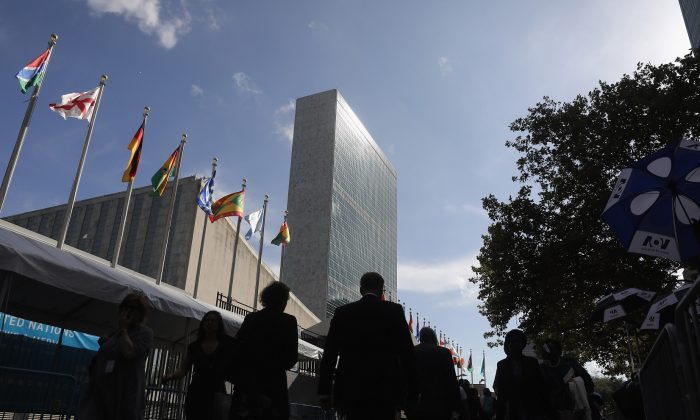 People walk past the United Nations headquarters in New York City on Sept. 26, 2018. (John Moore/Getty Images)