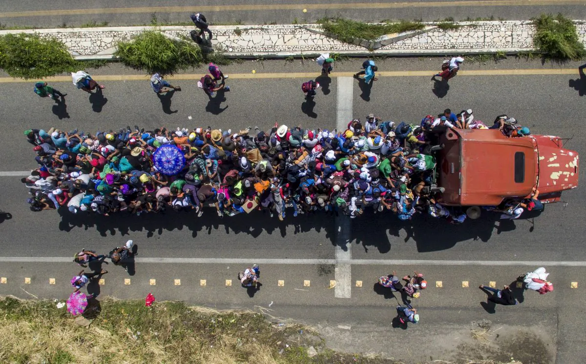 Aerial view of Honduran migrants onboard a truck as they take part in a caravan heading to the US, in the outskirts of Tapachula, on their way to Huixtla, Chiapas state, Mexico, on Oct. 22, 2018. (Pedro Pardo/AFP/Getty Images)
