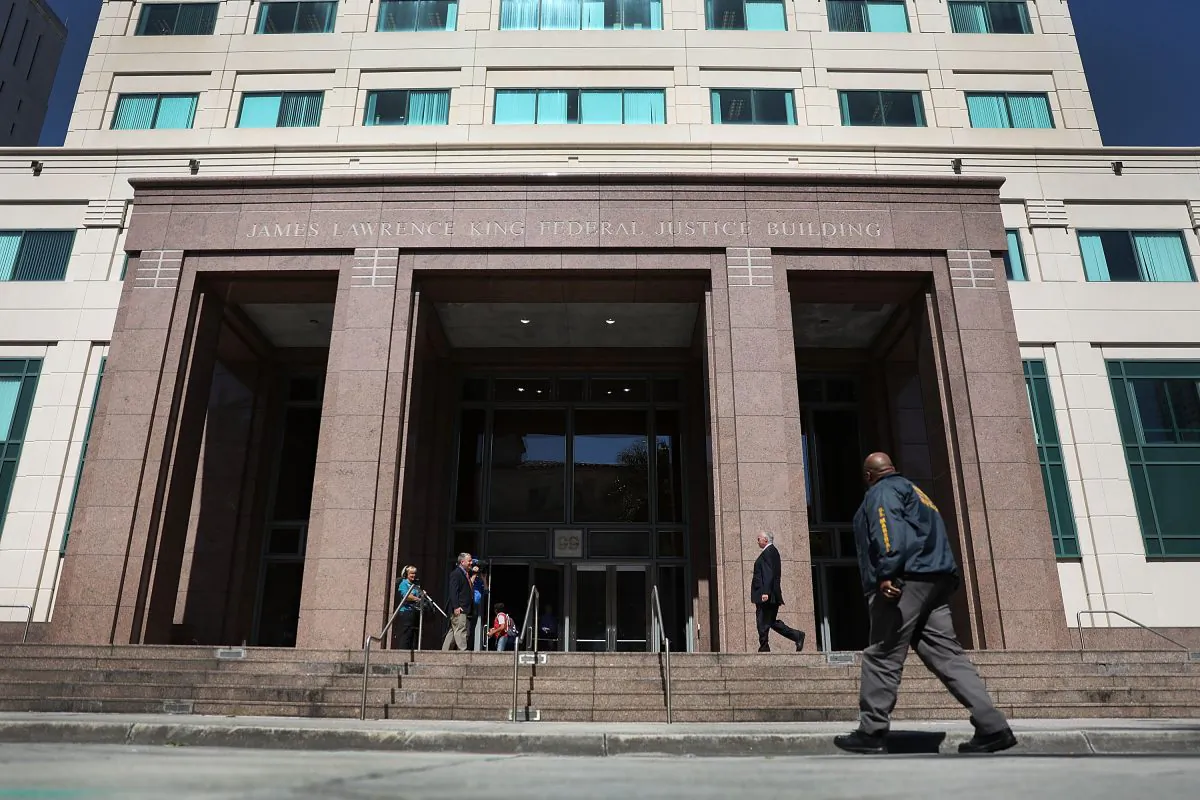 A member of the U.S. Marshals Service walks in front of the Federal District court for the Southern District of Florida. (Joe Raedle/Getty Images)
