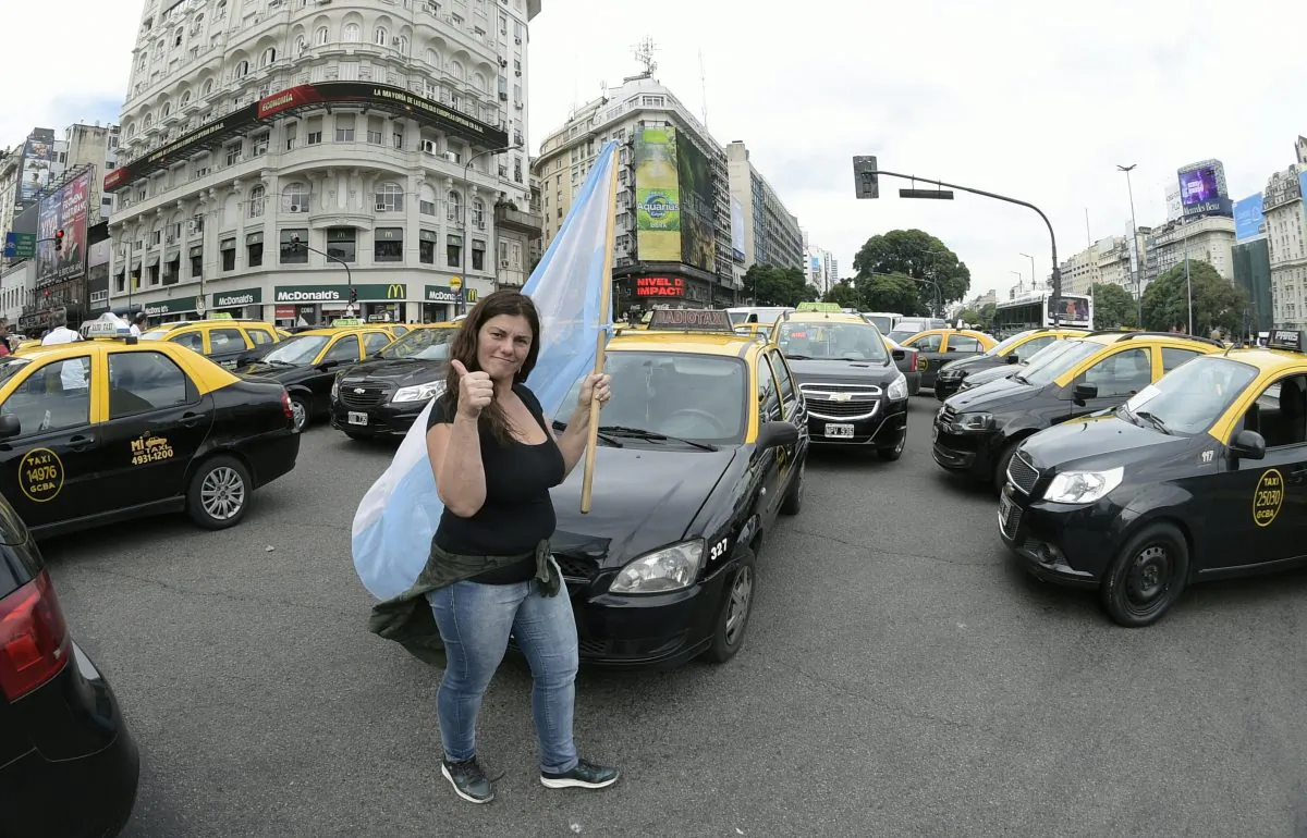 Taxi drivers block streets during a protest against Uber in Buenos Aires, Argentina, on Apr. 20, 2016. On top of protests, taxi cartels have resorted to vandalism to protect their market. (JUAN MABROMATA/AFP/Getty Images)
