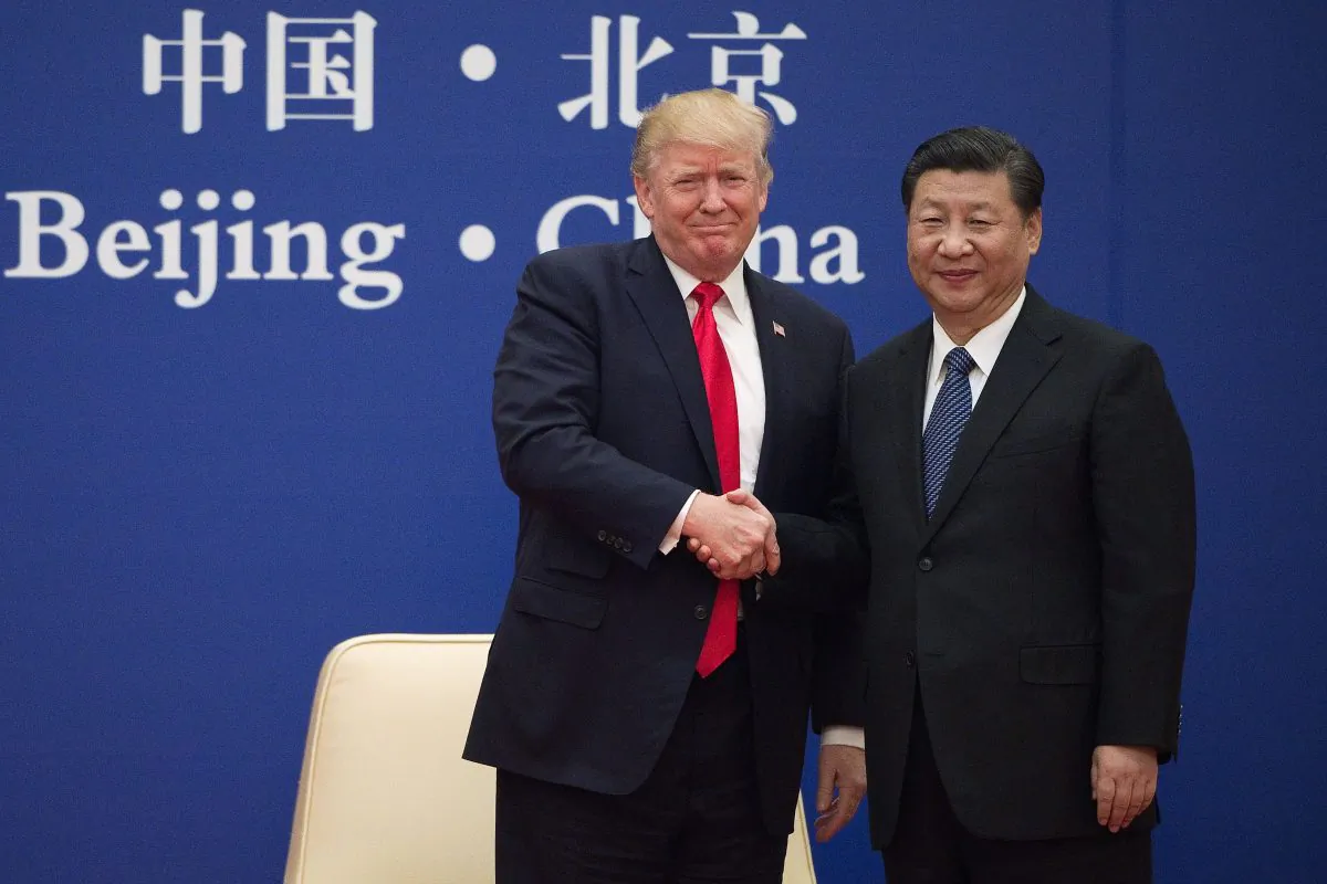 U.S. President Donald Trump and Chinese leader Xi Jinping shake hands at the Great Hall of the People in Beijing on Nov. 9, 2017. (Nicolas Asfouri/AFP/Getty Images)