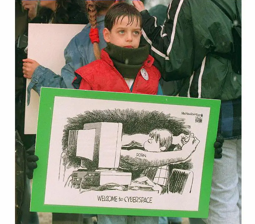 Seven-year-old Mark Rayer of Fairfax, Va., protests child pornography on the internet outside of the US Supreme Court Building in Washington on March 19, 1997. (TIM SLOAN/AFP/Getty Images)