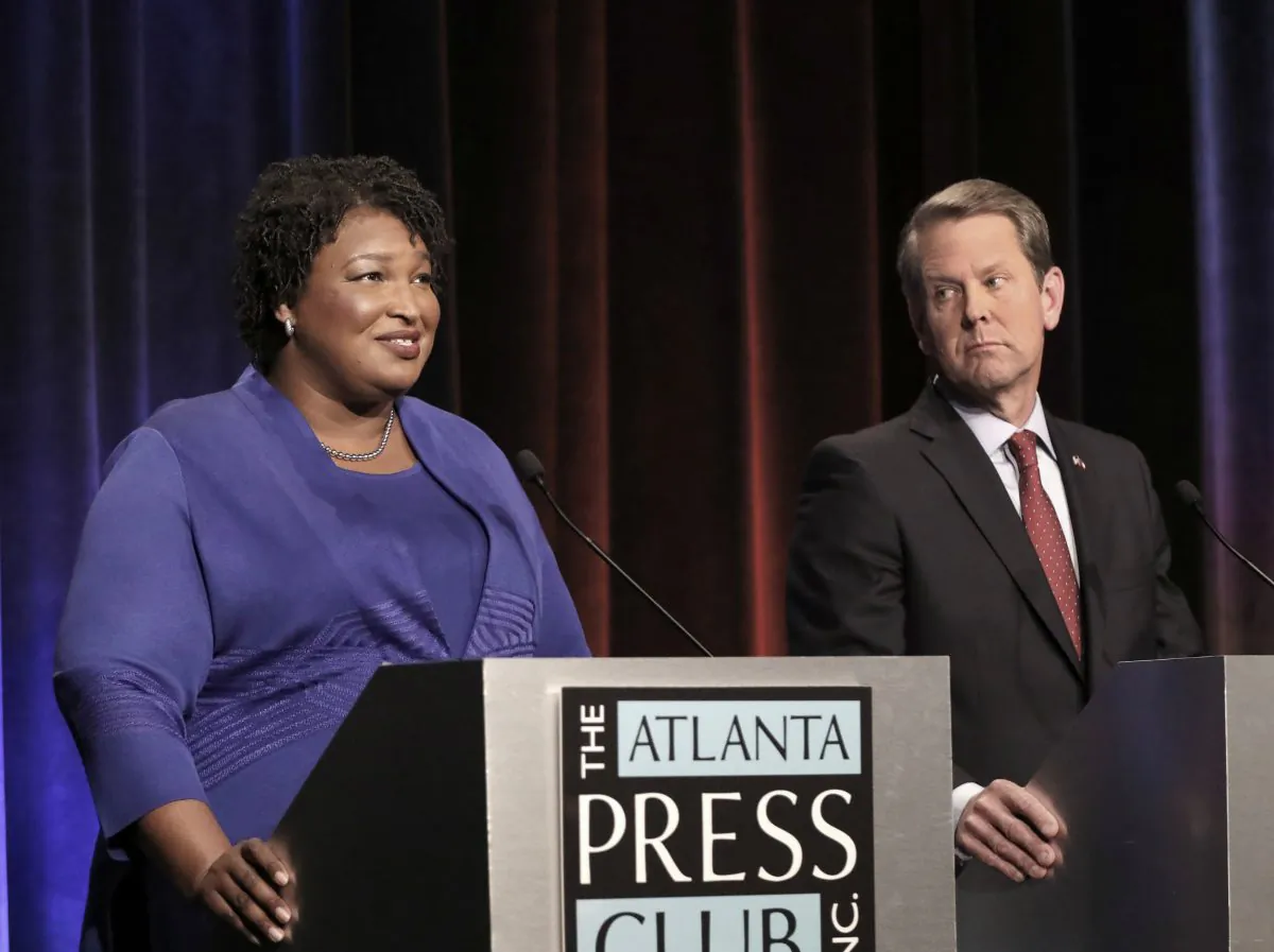 Georgia gubernatorial candidates (L-R) Democrat Stacey Abrams and Republican Brian Kemp debate in an event that also included Libertarian Ted Metz at Georgia Public Broadcasting in Midtown Oct. 23, 2018 in Atlanta, Georgia. (John Bazemore-Pool/Getty Images)