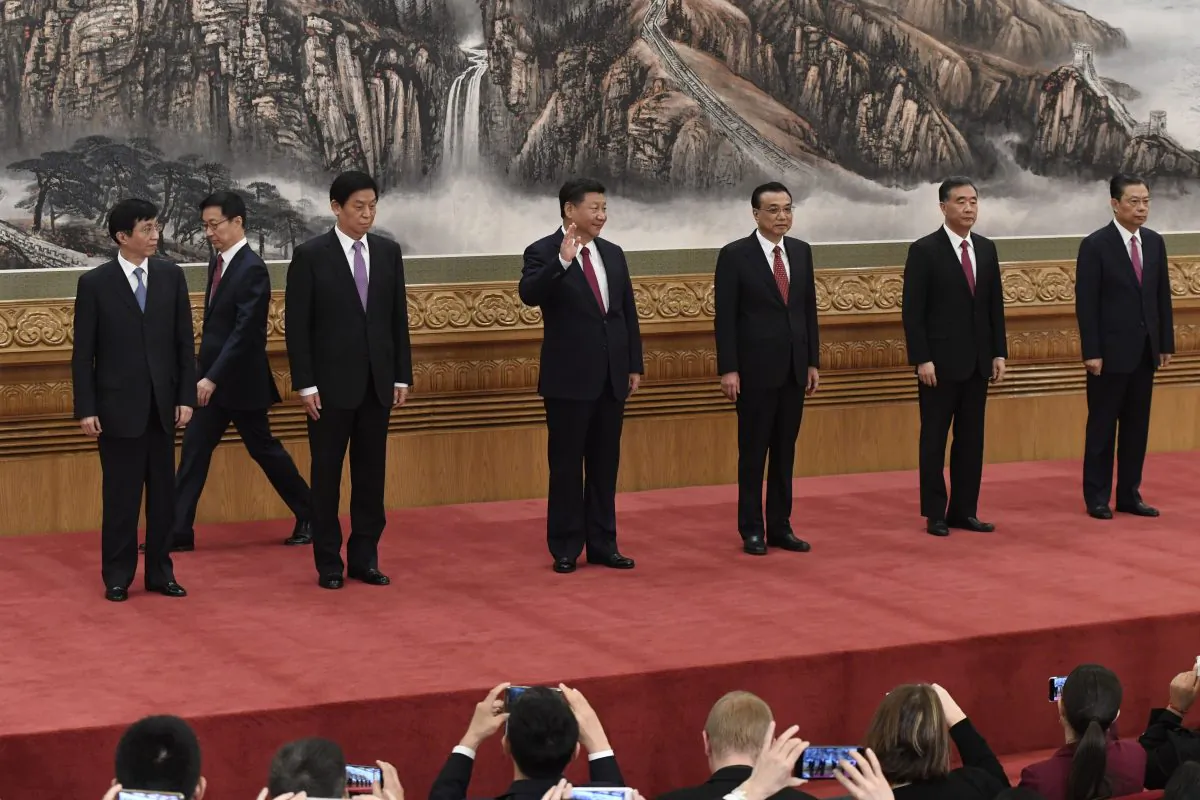 Chinese President Xi Jinping (Center) and other new members of the Communist Party of China's Politburo Standing Committee (L-R) Wang Huning, Han Zheng, Li Zhanshu, Li Keqiang, Wang Yang, Zhao Leji meet press in Beijing's Great Hall of the People on October 25, 2017. (WANG ZHAO/AFP/Getty Images)