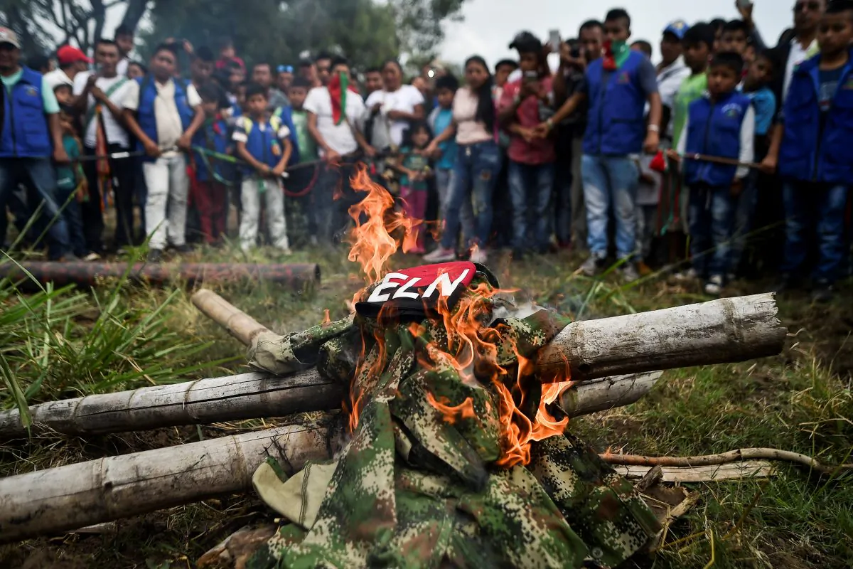 Indigenous people of the Nasa ethnic group burn uniforms seized from ELN guerrillas on July 6, 2018, in Corinto, Cauca department, Colombia. (Luis Robayo/AFP/Getty Images)