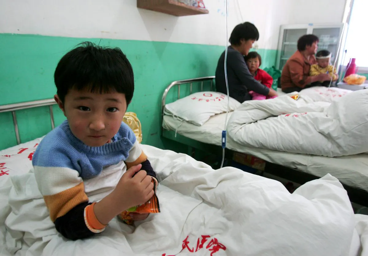 A young girl who suffers from the hand, foot and mouth disease undergoes treatment at a hospital in Fuyang City, Anhui Province, China, on April 28, 2008. (China Photos/Getty Images)