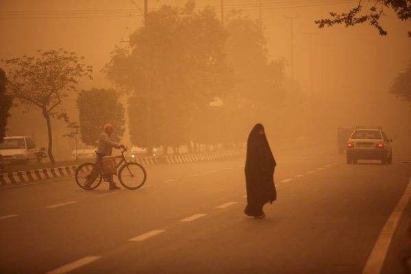 Iranians cross a street in Khuzestan