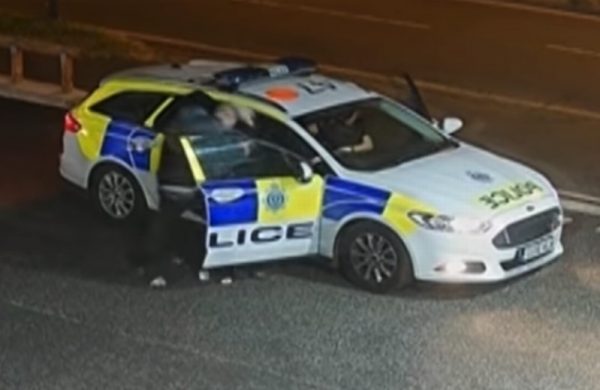 suspect manhandles a policewoman