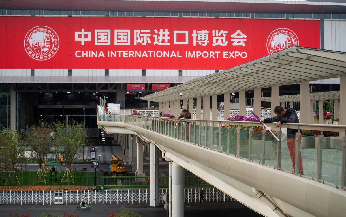 Workers are seen in front of the National Exhibition and Convention Center in Shanghai, China on Oct. 31, 2018. It will be the main venue to host the upcoming first China International Import Expo (CIIE), set to run from Nov. 5-10. (Johannes Eisele/Photo/AFP/Getty Images)
