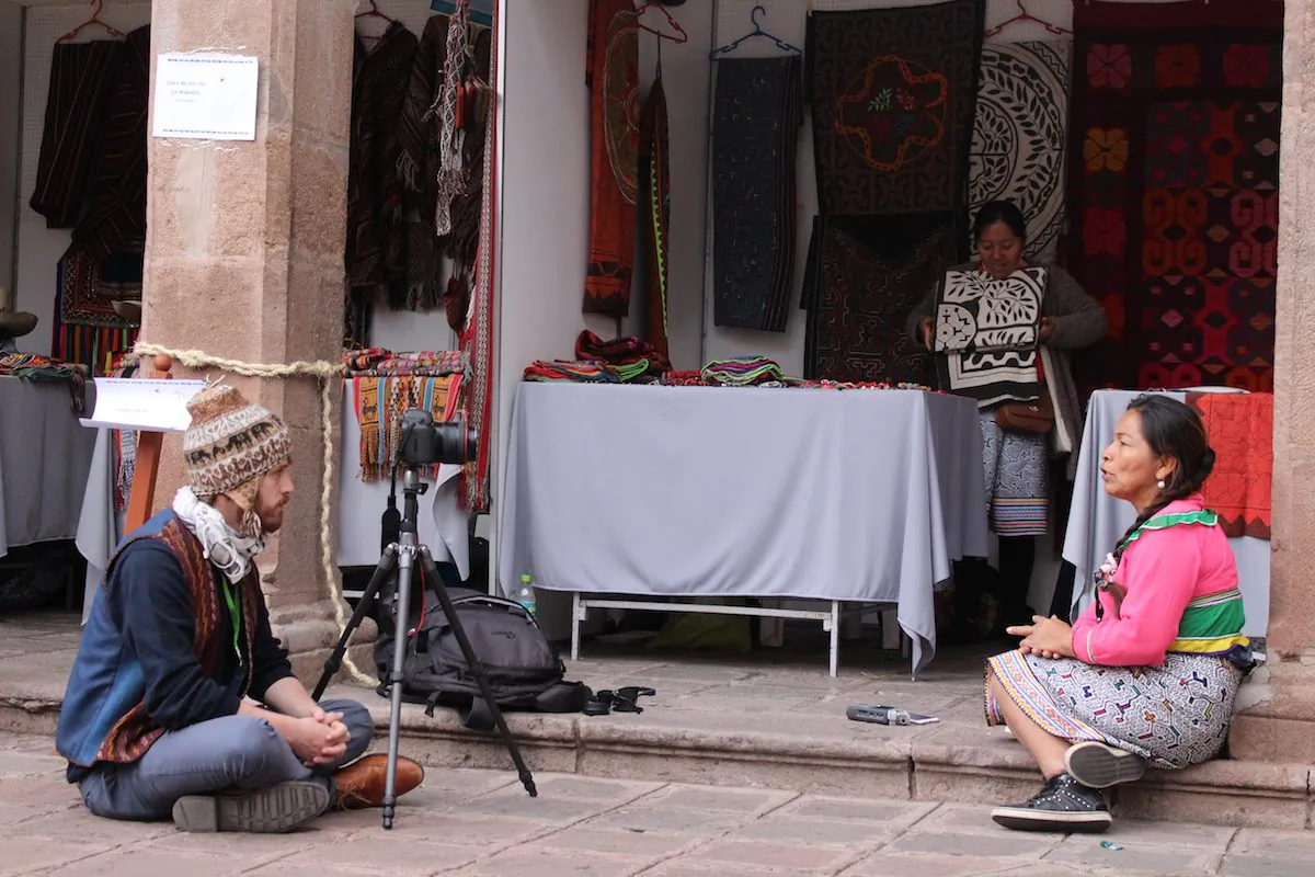 Daniel Bogre Udell (L) records a textile artist, named Luz, speaking a language from the Amazon called Shipibo, in Peru. (Courtesy of Daniel Bogre) Udell/Wikitongues)