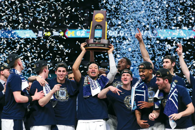 Clubs and organizations routinely express their values. The National Collegiate Athletic Association (NCAA), for example, has its rules about amateurism and competitive balance. (Above) Jalen Brunson of the Villanova Wildcats raises the trophy and celebrates with his teammates after defeating the Michigan Wolverines during the 2018 NCAA Men's Final Four National Championship game in in San Antonio, Texas, on April 2, 2018. (TOM PENNINGTON/GETTY IMAGES)
