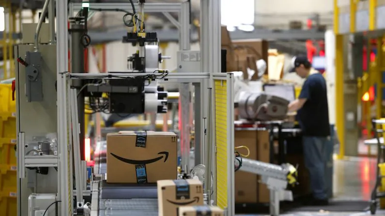 In this Aug. 3, 2017, file photo, packages pass through a scanner at an Amazon fulfillment center in Baltimore, Maryland. (Photo/Patrick Semansky, File)