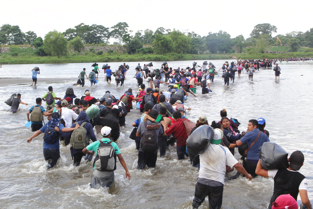 The fourth migrant caravan crossing the Suchiate River into Mexico