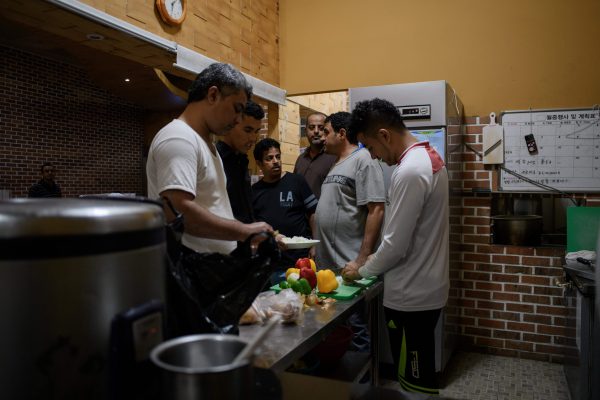 Yemeni asylum-seekers prepare lunch at the Olle Tourist Hotel in Jeju, South Korea.