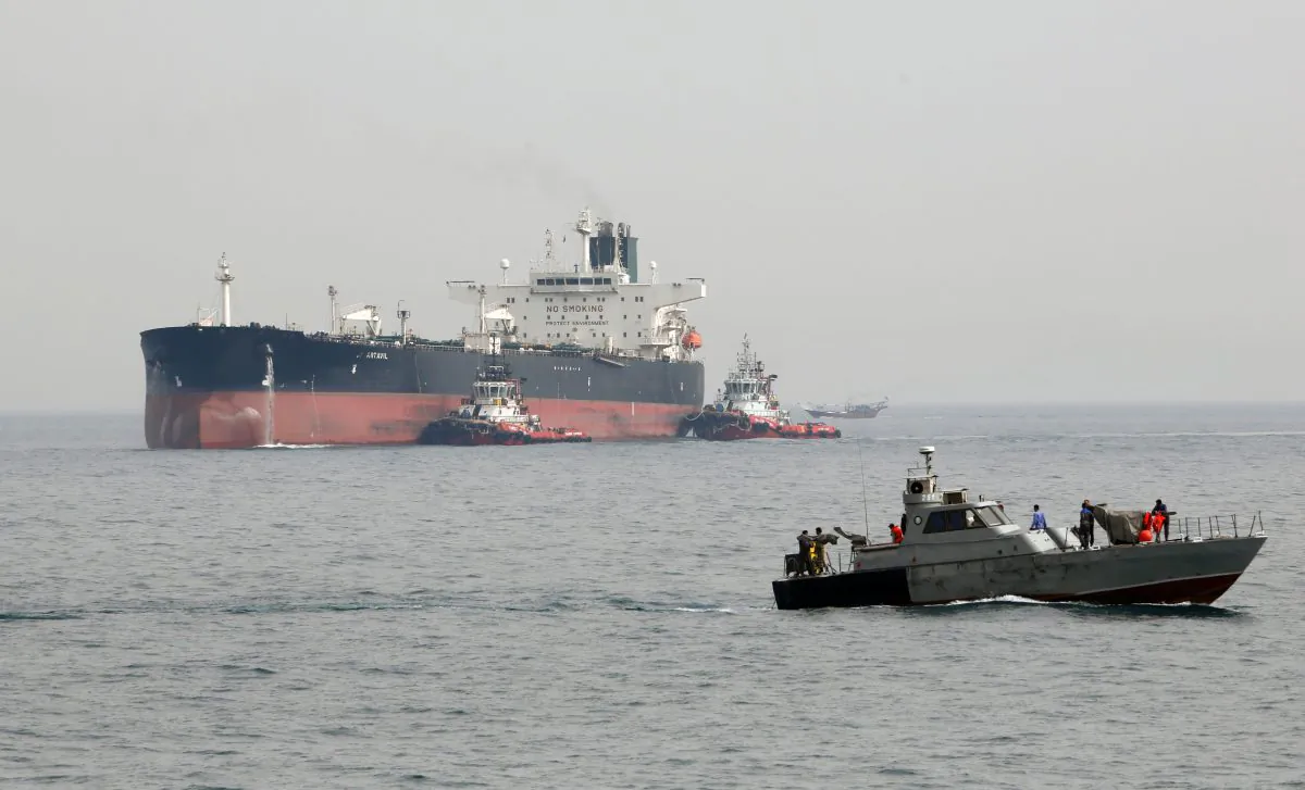 An Iranian military speedboat patrols the waters as a tanker prepares to dock at the oil facility in Iran’s Kharg Island, on the shore of the Persian Gulf, on March 12, 2017. (ATTA KENARE/AFP/Getty Images)
