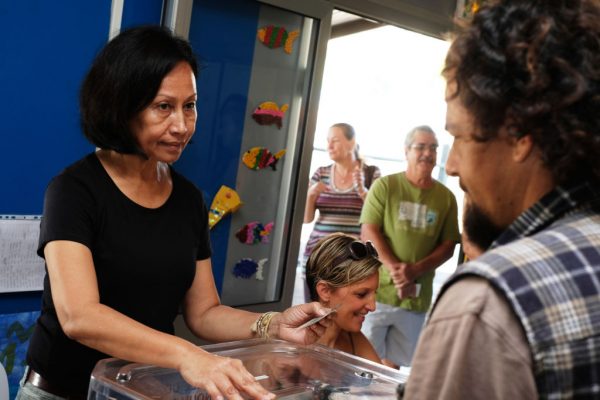people at a New Caledonia polling station