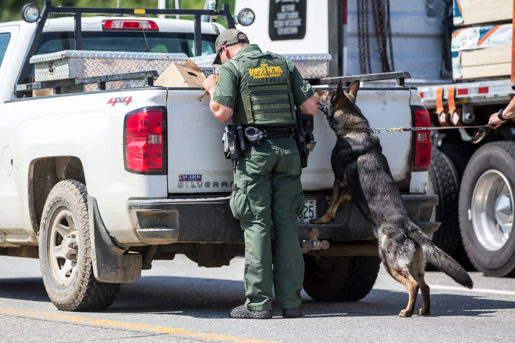 File photo showing U.S. Border Patrol agents searching a vehicle at a highway checkpoint on Aug. 1, 2018, in West Enfield, Maine, on Aug. 1, 2018. (Scott Eisen/Getty Images)