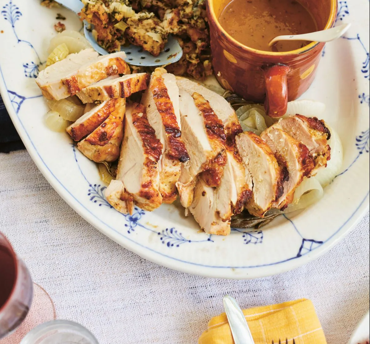 Roast turkey breast and onions with mustard and sage, on a Thanksgiving platter. (David Loftus)