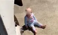 Video: FedEx Driver Discovers Baby Crawling Under His Truck