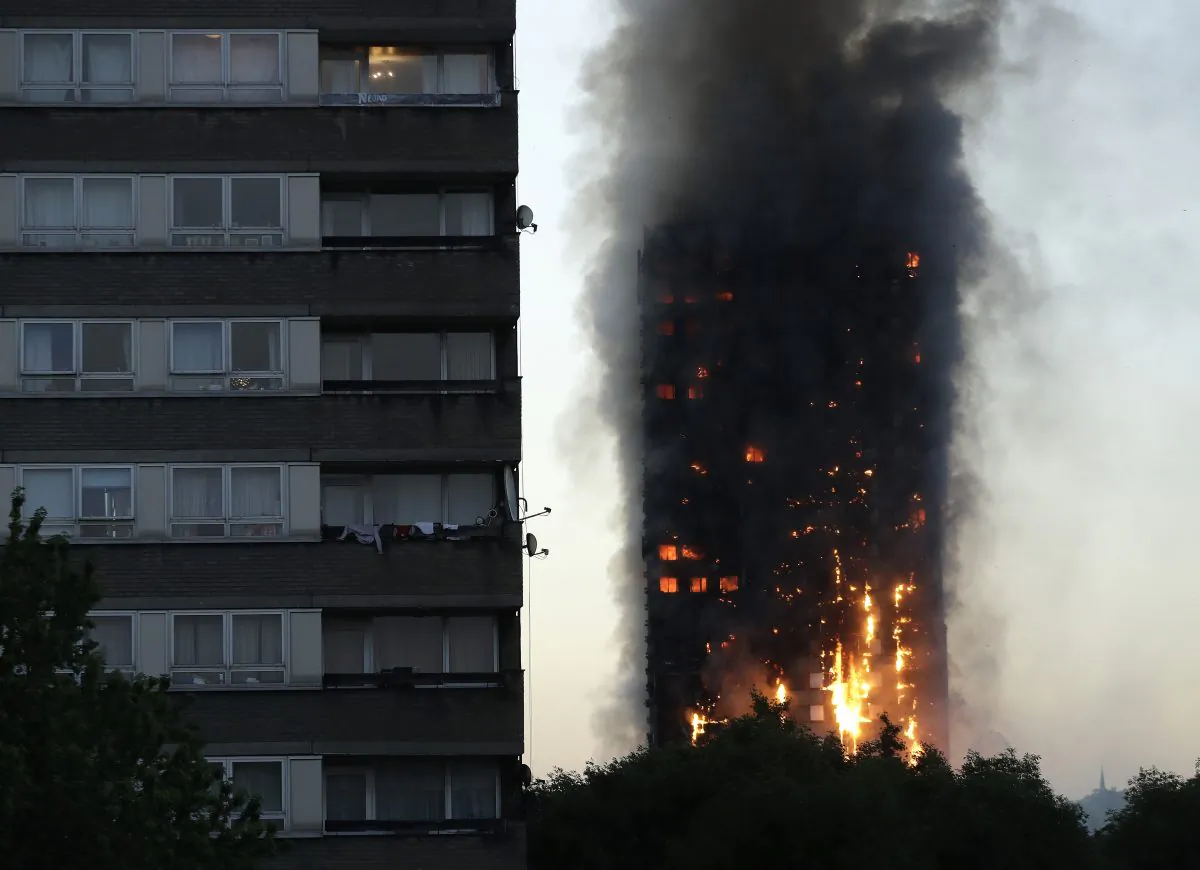 The Grenfell Tower high-rise building in west London engulfed in smoke on the morning of June 14, 2017. (Matt Dunham, File/AP Photo)