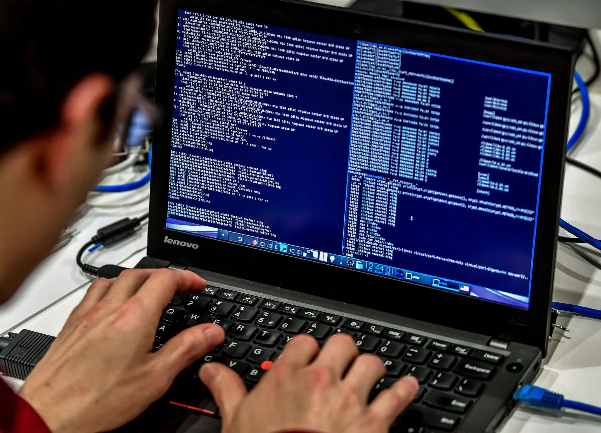 A person works at a computer during the 10th International Cybersecurity Forum in Lille on January 23, 2018. (PHILIPPE HUGUEN/AFP/Getty Images)