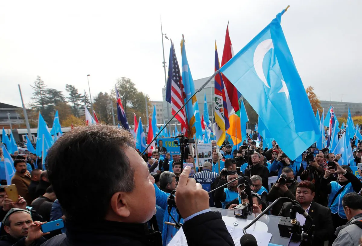 Dolkun Isa, President of the World Uyghur Congress, gestures as he speaks during a demonstration against China during its Universal Periodic Review by the Human Rights Council in front of the United Nations Office in Geneva, Switzerland on Nov. 6, 2018. (Denis Balibouse/Reuters)