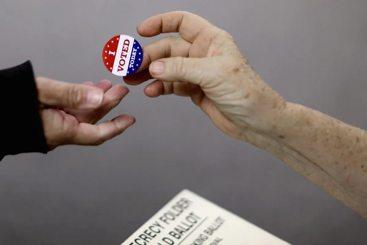 Voters get an 'I VOTED TODAY' sticker after casting their ballots on election day in Red Oak, Iowa on November 4, 2014. (Chip Somodevilla/Getty Images)