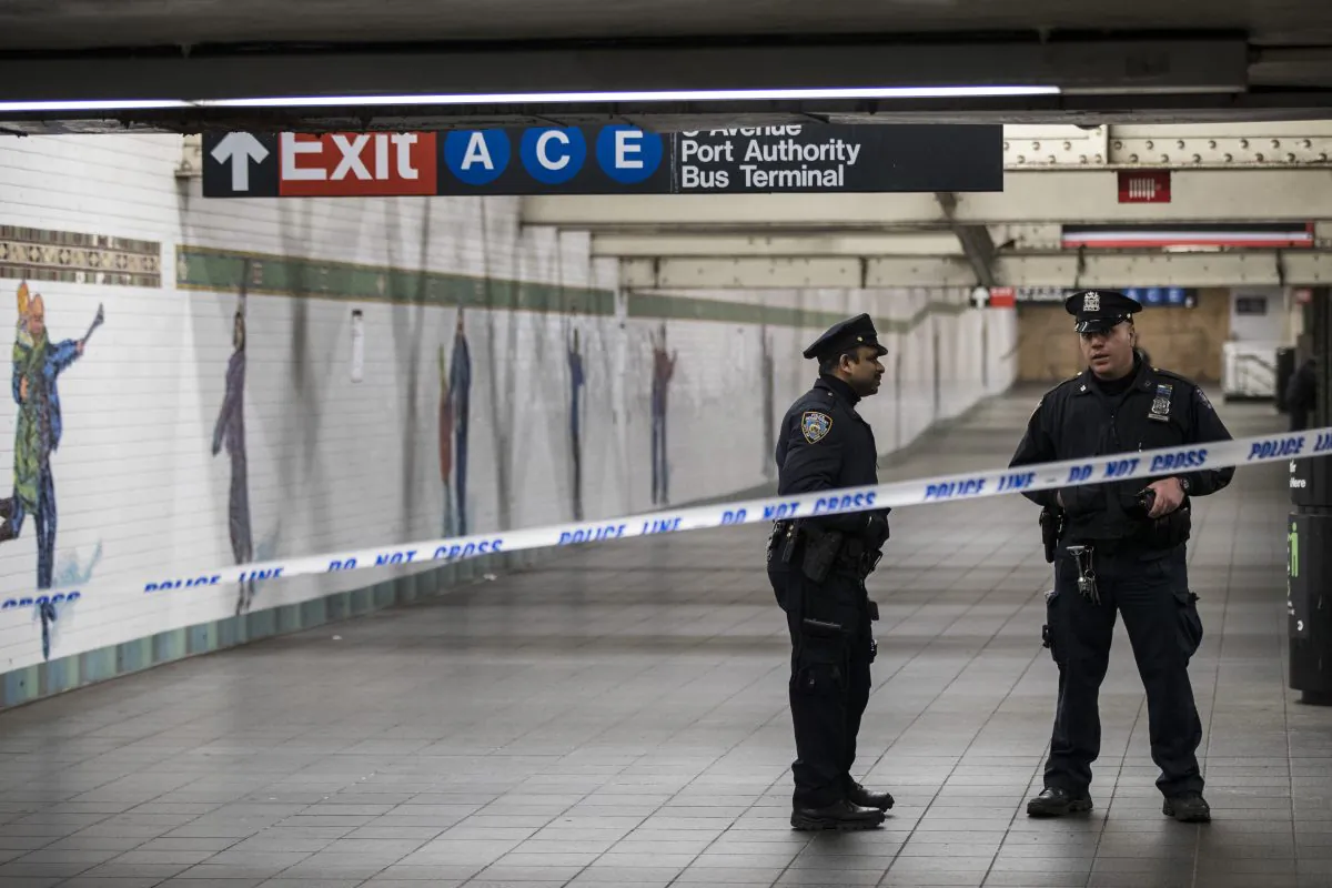 Police stand in a closed-off underground walkway near the site of a pipe bomb explosion in the tunnel that connects the Times Square subway station to the Port Authority Bus Terminal, on Dec. 11, 2017. (City.gerer/Getty Images)