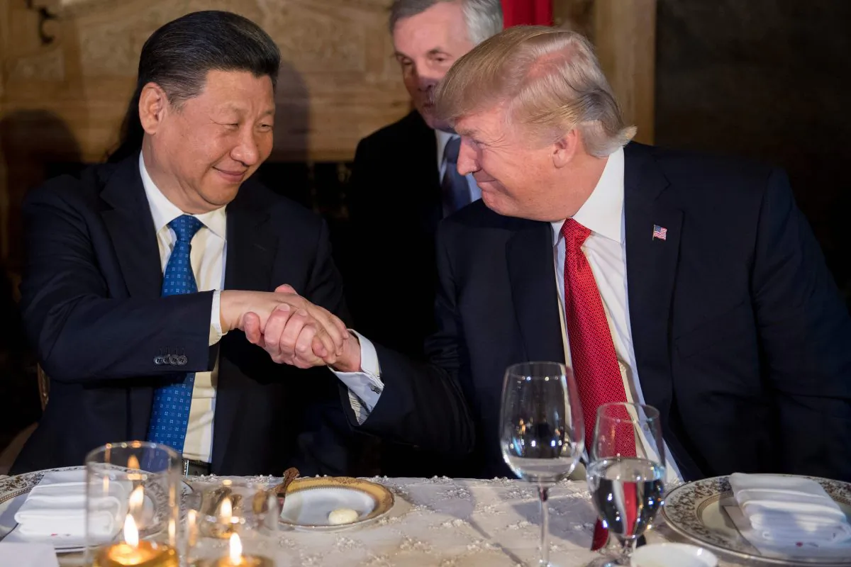 U.S. President Donald Trump (R) and Chinese leader Xi Jinping (L) shake hands during dinner at the Mar-a-Lago estate in West Palm Beach, Florida, on April 6, 2017. (Jim Watson/AFP/Getty Images)