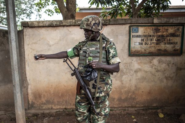 A soldier with the African-led International Support Mission to the Central African Republic holds a Chinese hand grenade.