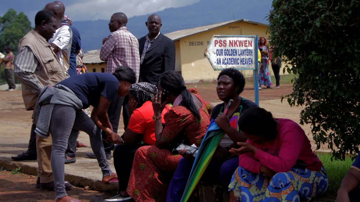 Parents await for news of their children at a school where 79 pupils were kidnapped in Bamenda, Cameroon, on Nov. 6, 2018. (Blaise Eyong/Reuters)