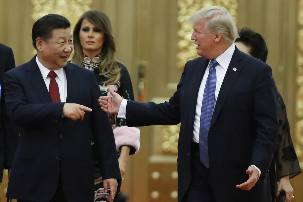 Chinese leader Xi Jinping and U.S. President Donald Trump arrive at a state dinner in Beijing on Nov. 9, 2017. (Thomas Peter - Pool/Getty Images)