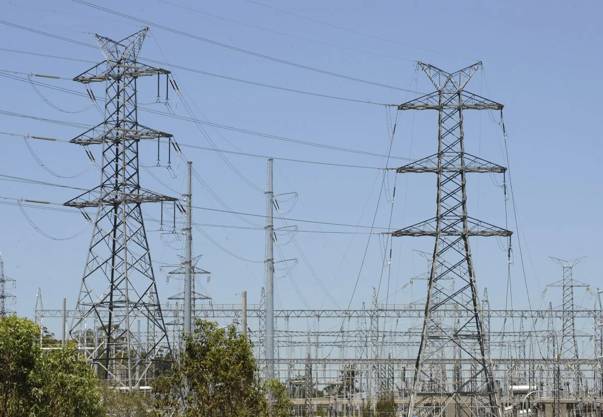 Power lines run across a section near Brisbane, Australia, on Nov. 3, 2009. Households will pay significantly more for their power when a proposed Emissions Trading Scheme is introduced. The Australian government on Nov. 7 warned it intends to block a Hong Kong and Chinese consortium’s 13 billion Australian dollar ($9 billion) takeover bid for an energy infrastructure company because it conflicts with Australia’s national interest. (Dave Hunt/AAP Image via AP)
