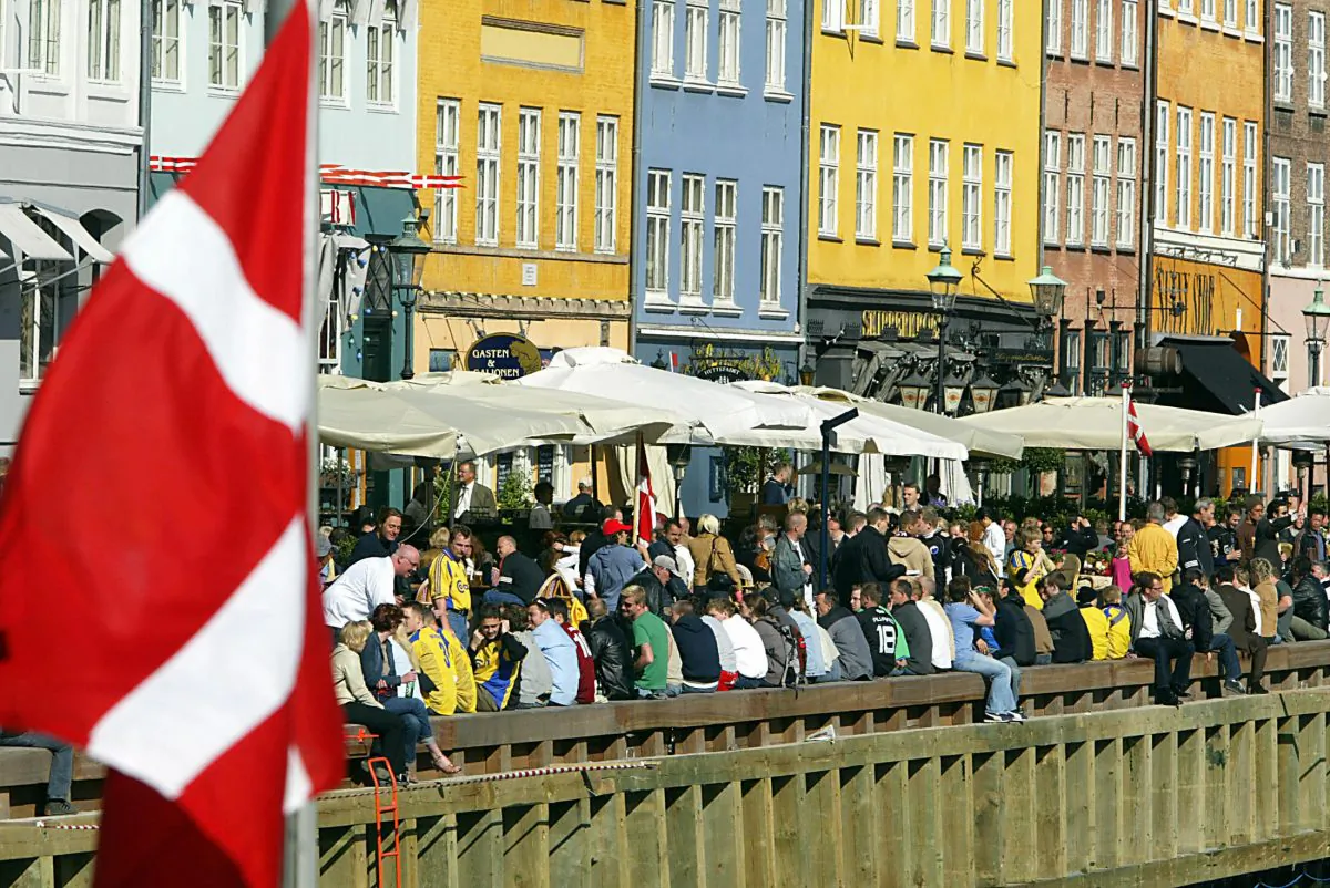 The Danish flag flies over Nyhavn canal area  in Copenhagen on May 13, 2004. (Odd Andersen/AFP/Getty Images)