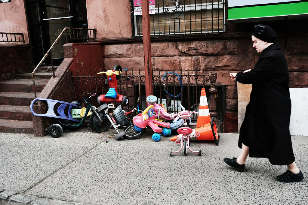 A Hasidic woman walks through a Jewish Orthodox neighborhood in Brooklyn, N.Y. on Apr. 24, 2017. (Spencer Platt/Getty Images)