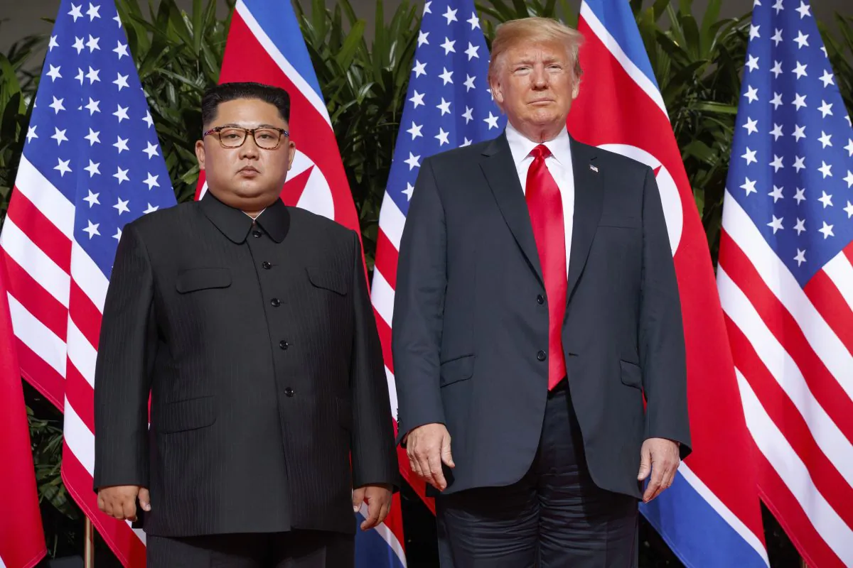 President Donald Trump stands with North Korean leader Kim Jong Un on Sentosa Island in Singapore, on June 12, 2018. (Evan Vucci/AP)