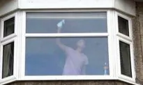 UK Police Posts Photo of Woman Cleaning Windows as a Warning
