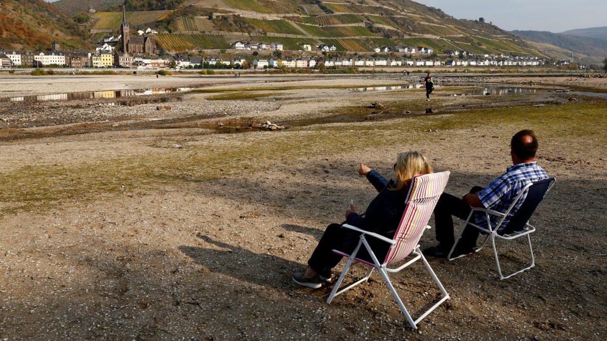 couple sit on their camping
